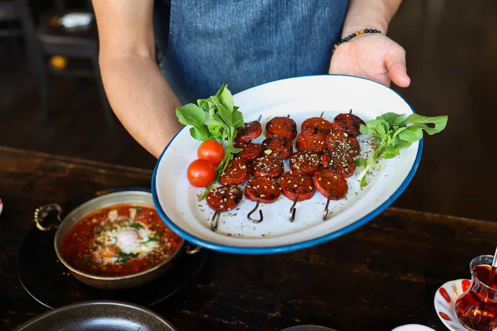 Traditional Turkish breakfast spread with tea, bread, and small plates